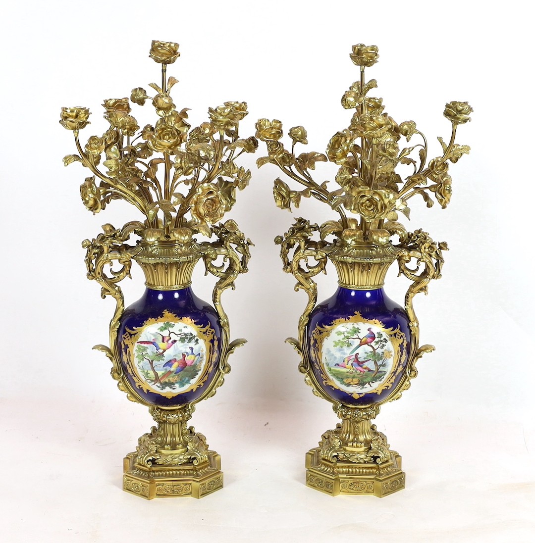 A pair of large French Sevres style ormolu mounted candelabra, in Louis XVI style, 19th century, 69cm high